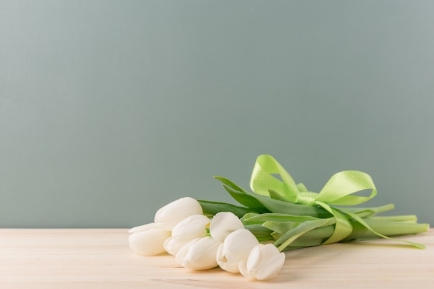 Tender white tulips in bunch