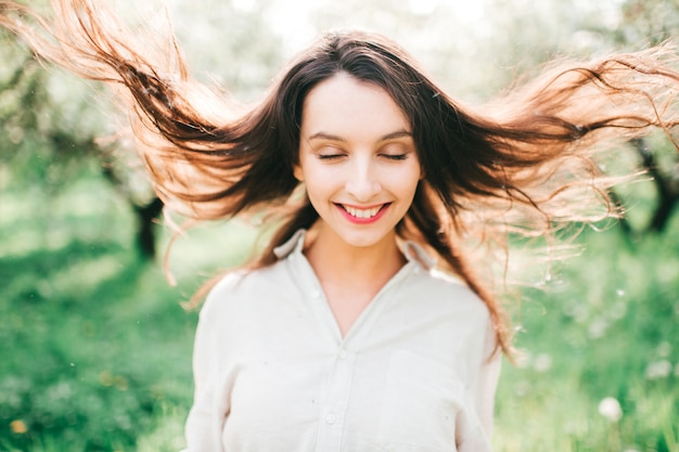 Tender woman portrait in garden