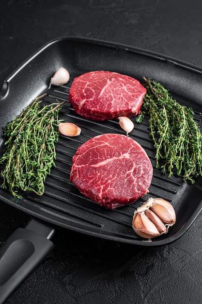 Tenderloin Raw Fillet Mignon beef steaks on a pan Black background Top view