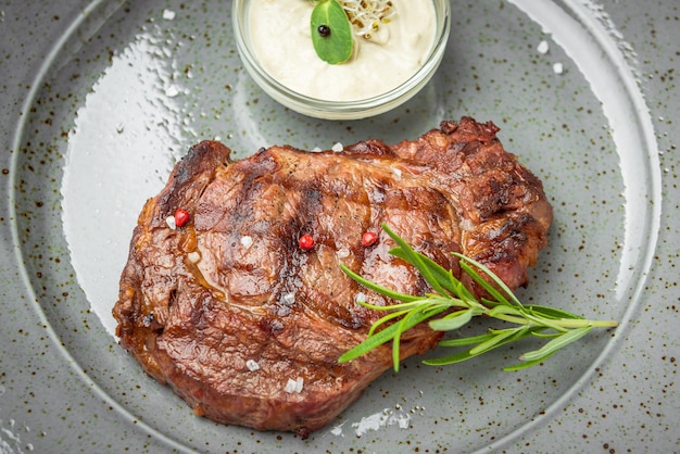 Tenderloin steak on plate with sauce