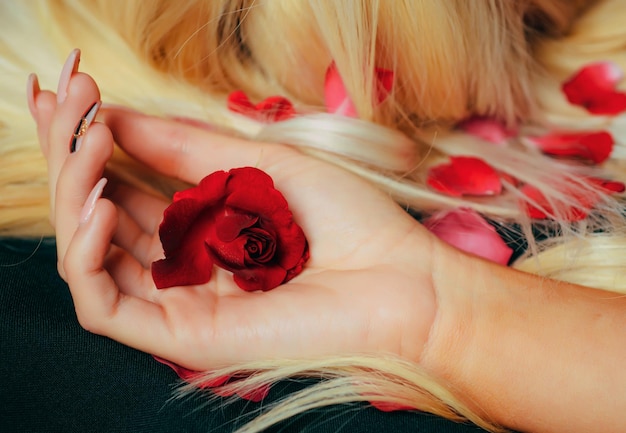 Tenderness hand fashion art hand woman with roses flowers on her hand creative beauty photo hand gir