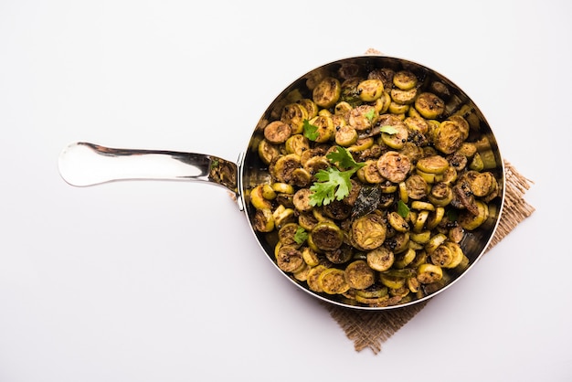 Tendli or Kundroo sabzi or Kovakkai Poriyal also known as ivy gourd, served in a bowl or karahi. selective focus