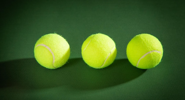 Tennis ball on the green background