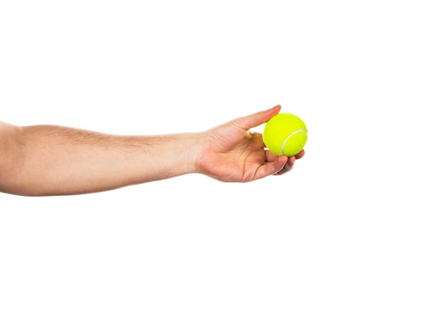 Photo tennis ball in male hand isolated on a white background