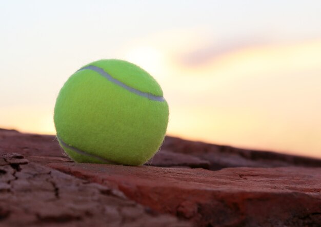 Tennis ball on old brick surface