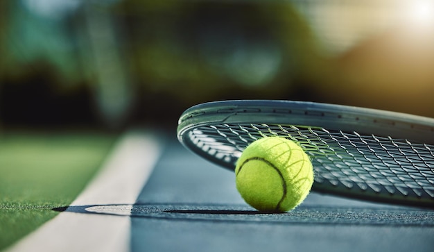 Tennis ball racket and court ground with mockup space blurred background or outdoor sunshine Summer sports equipment and mock up for training fitness and exercise at game contest or competition