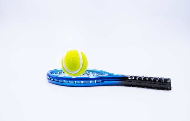 Photo tennis ball and racket is on white background