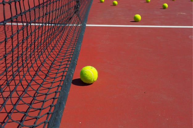 Tennis ball on a tennis court with net