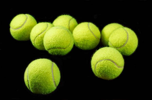 Tennis balls on black background space for text sport concept