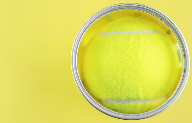 Tennis balls on yellow background