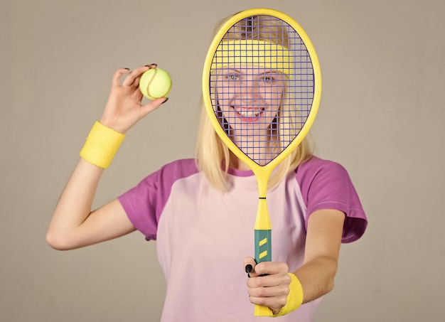 Tennis club concept tennis sport and entertainment active\
leisure and hobby girl fit slim blonde play tennis sport for\
maintaining health active lifestyle woman hold tennis racket in\
hand