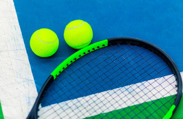 tennis equipment on blue court