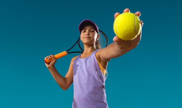 Photo tennis player beautiful girl teenager and athlete with racket in pink sporswear and hat on tennis court fashion and sport concept