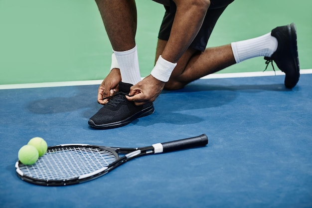 Tennis Player Tying Sports Shoes