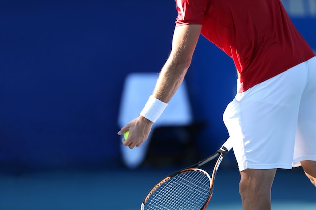 tennis player with blue backgound