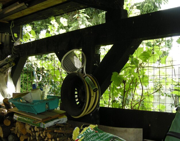 Tennis racket on metal in barn