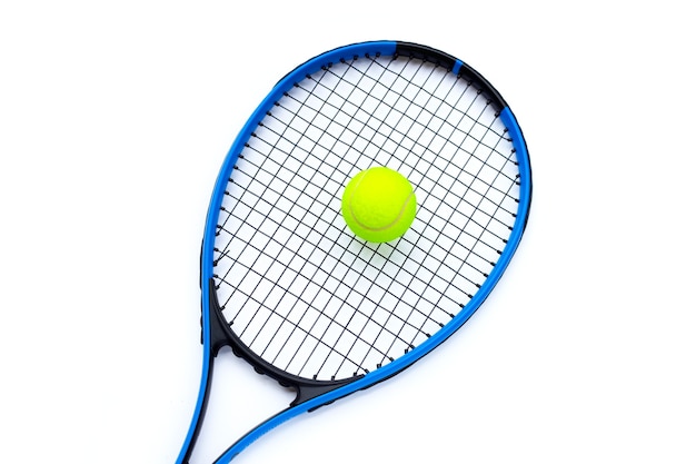 Tennis racket with ball on white background.