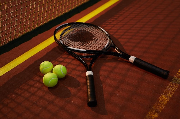 Tennis racquets of competitors on court