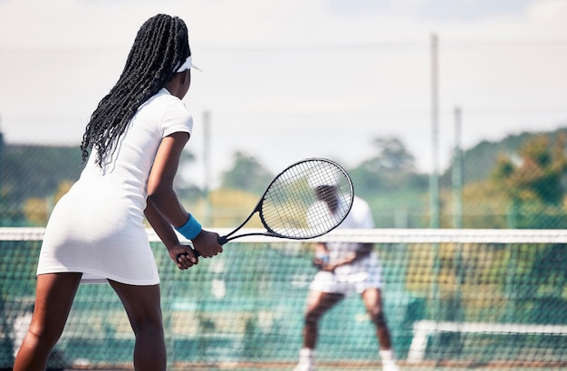 Tennis team game and african couple workout competition sports exercise or outdoor wellness Tennis court athlete tennis player and african woman with racket for competition or teamwork fitness