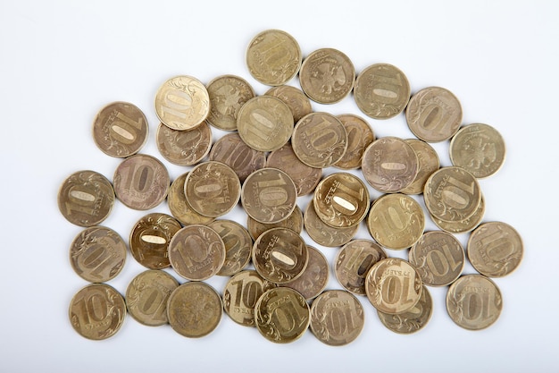 Tenruble coins on a white background