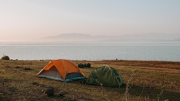 tent on beach by sea against sky