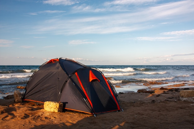 Tent by the sea against the blue sky.