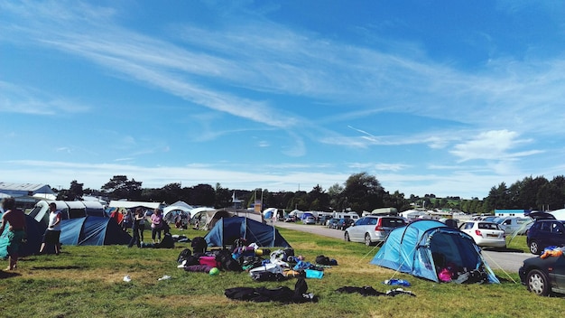 Tent on field against sky