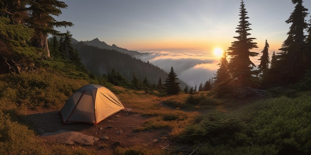 A tent is set up in the mountains at sunrise.