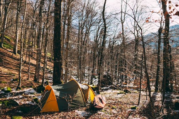 Tent and kayak in the forest winter forest in montenegro