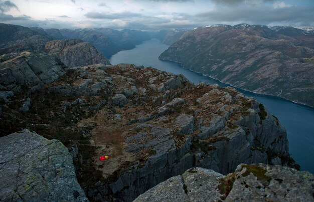 Photo tent in mountains by fjord