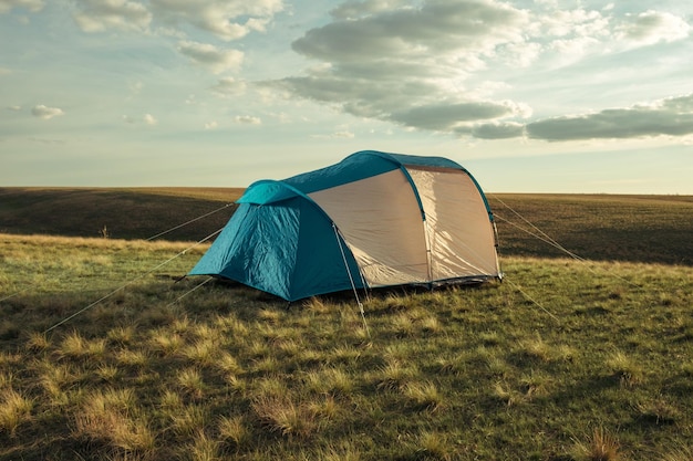 Photo tent in the steppe against the backdrop of the sunset