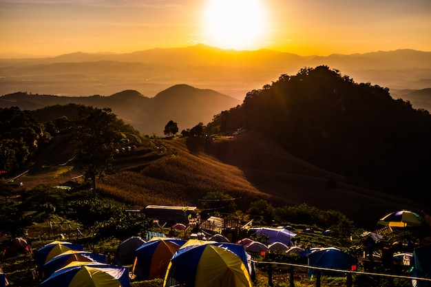 Tent in the sunset overlooking mountains