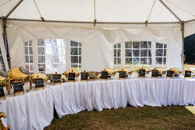 a tent with a table and flowers on it