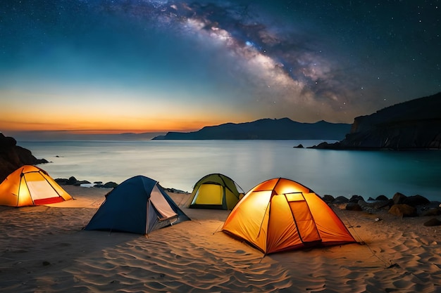 Tenten op een strand 's nachts met de melkweg op de achtergrond