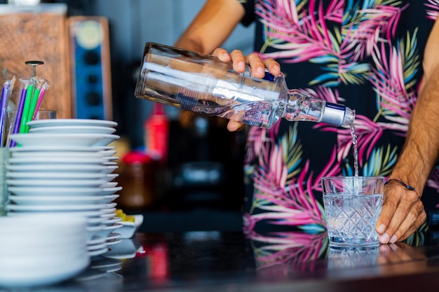 Tequila preparing close up in summer bar at beach