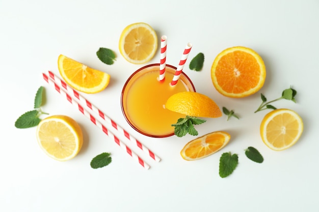 Tequila sunrise cocktail and ingredients on white background