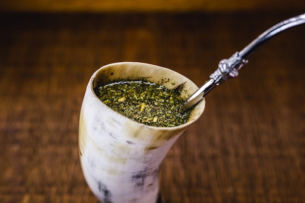 Terere, yerba mate drink typical of south america, served in an atersanal horn