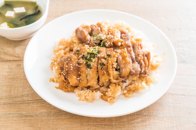 teriyaki chicken on topped rice with miso soup