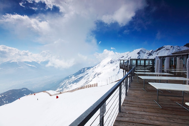 Terrace on top of snowy mountain and cloudy sky landscape