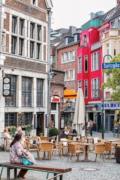 Terrace with people in front of the restaurant in city Aachen in Germany