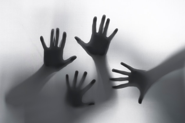 Terrifying hands silhouettes in studio