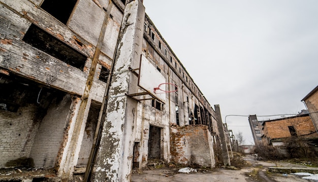 Territory of abandoned industrial area waiting for demolition. Factory ruins.