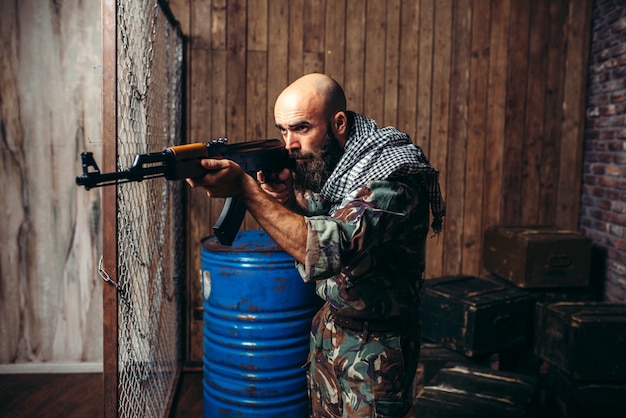 Terrorist aiming from a kalashnikov rifle