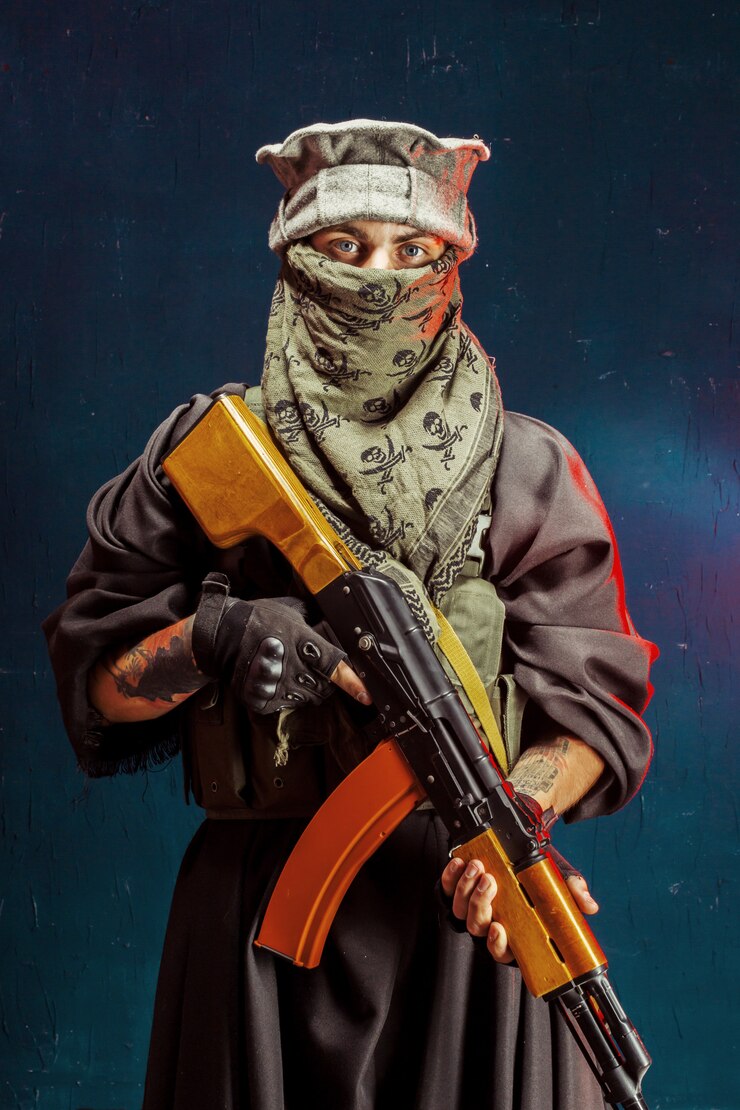 Photo terrorist with his weapon.  about terrorism