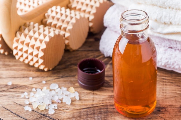 Terry towel and cosmetic oil for massage.