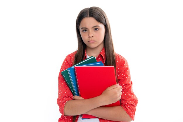 Terug naar school portret van tiener schoolmeisje met boeken kinderen school en onderwijs concept schoolmeisje student boos tienermeisje boos en ongelukkig negatieve emotie