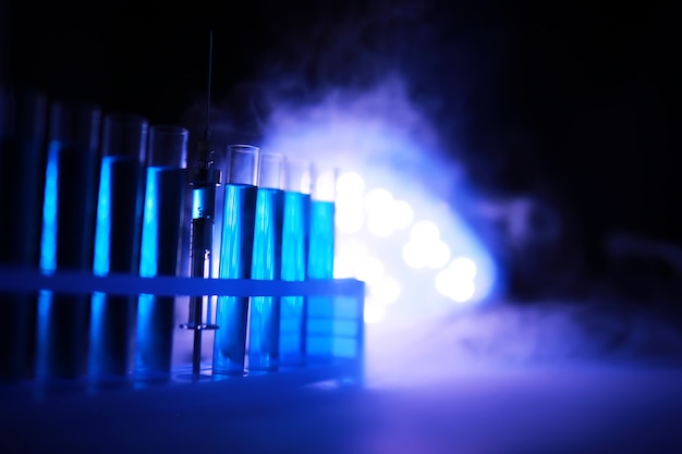 Test tube of glass overflows new liquid solution potassium blue conducts an analysis reaction takes various versions reagents using chemical pharmaceutics cancer manufacturing .