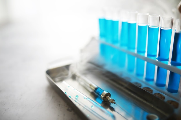 Test tube of glass overflows new liquid solution potassium blue conducts an analysis reaction takes various versions reagents using chemical pharmaceutics cancer manufacturing .