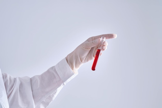 Photo test tube with blood in the hand