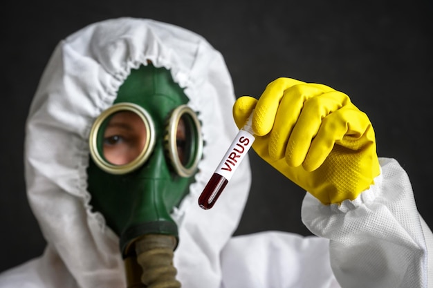 Photo test tube with virus in hands of scientist in lab